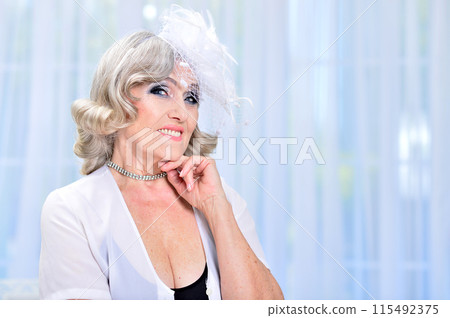Portrait of happy senior woman posing at home 115492375