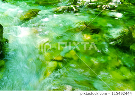 The beautiful emerald green water of the Tsukechi River 115492444