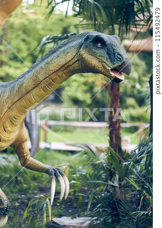 Head close-up Therizinosaurus is a predatory dinosaur species with hypertrophied nails, the strangest dinosaur from the very end of the Cretaceous period. Close-up with copy space. High quality photo 115492479