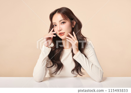 Beautiful young asian woman with clean fresh skin on beige background, Face care, Facial treatment, Cosmetology, beauty and spa, Asian women portrait. Beautiful young asian woman with clean fresh skin on beige background, Face care, Facial treatment, Cosmetology, beauty and spa, Asian women portrait. 115493833