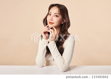Beautiful young asian woman with clean fresh skin on beige background, Face care, Facial treatment, Cosmetology, beauty and spa, Asian women portrait. 115493842