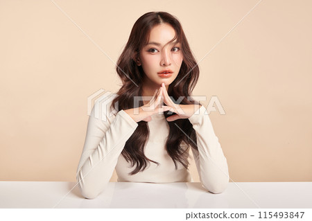 Beautiful young asian woman with clean fresh skin on beige background, Face care, Facial treatment, Cosmetology, beauty and spa, Asian women portrait. Beautiful young asian woman with clean fresh skin on beige background, Face care, Facial treatment, Cosmetology, beauty and spa, Asian women portrait. 115493847