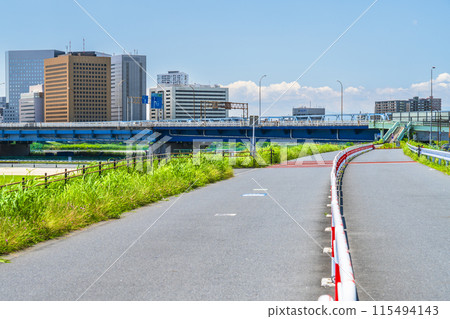 Buildings in front of Kawasaki Station as seen from the Tama River riverbed [Kawasaki City, Kanagawa Prefecture] 115494143
