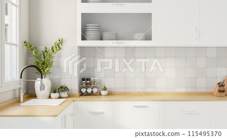 A minimalist white kitchen features a sink and a seasoning shelf on a wooden kitchen countertop. 115495370