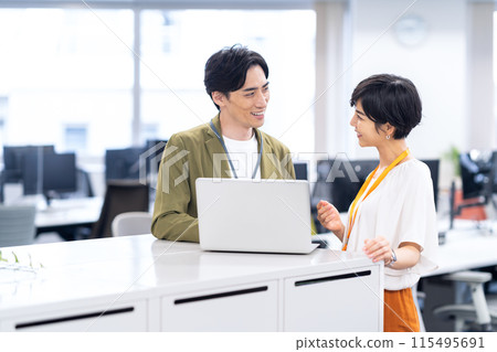 Young male and female engineers having a meeting in the office Young male and female engineers having a meeting in the office 115495691