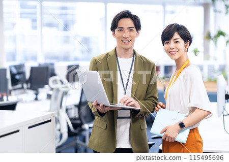 Young male and female engineers having a meeting in the office Young male and female engineers having a meeting in the office 115495696