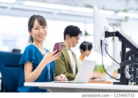 Young male and female engineers having a meeting in the office 115495733