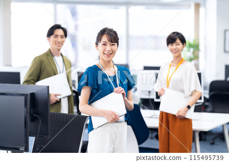 Young male and female engineers having a meeting in the office 115495739