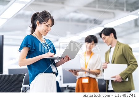 Young male and female engineers having a meeting in the office Young male and female engineers having a meeting in the office 115495741