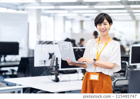 Young female engineer working in an office 115495747