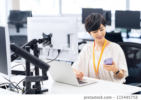 Young female engineer working in an office 115495758