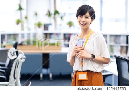 Young female engineer working in an office Young female engineer working in an office 115495763