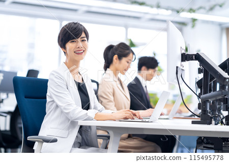 Male and female business people working in the office Male and female business people working in the office 115495778