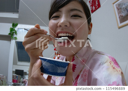 A woman eating ice cream A woman eating ice cream 115496889
