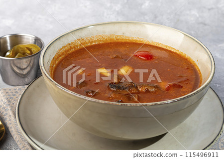 Tom yum soup with seafood, capers added nearby. Tom yum soup with seafood, capers added nearby. 115496911