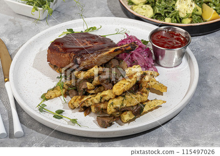 Meat on the bone with fried potatoes and mushrooms. Hot lunch. Meat on the bone with fried potatoes and mushrooms. Hot lunch. 115497026