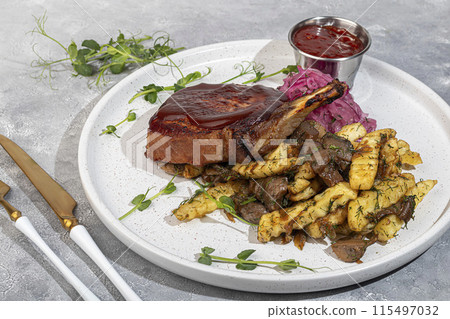 Meat on the bone with fried potatoes and mushrooms. Hot lunch. 115497032