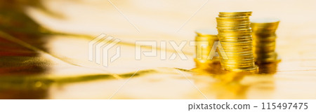 business and finance investment and saving activity with close up gold coin arrange on gold glitter background 115497475