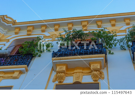 Elements of designer decoration of exterior parts of houses on streets of the city of Tangier in the Kingdom of Morocco. folk arts in the elements of decoration of facades of buildings, houses 115497643