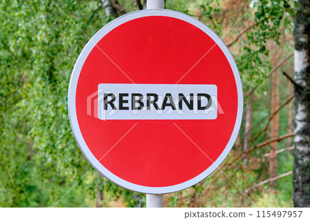 Business and achievement concept. REBRAND text written on the sign entry is prohibited against the background of the forest 115497957