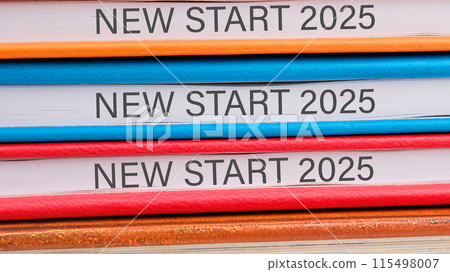 Business and New Start 2025 concept. Copy space. NEW START 2025 close-up on the ends of the notebooks 115498007