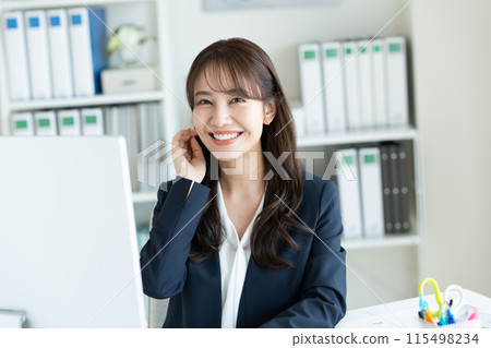 Young woman working in the office Young woman working in the office 115498234