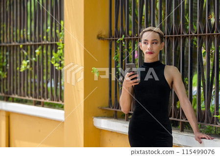 Beautiful Asian queer LGBT community supporter man with mustache wearing lipstick and jumpsuit 115499076
