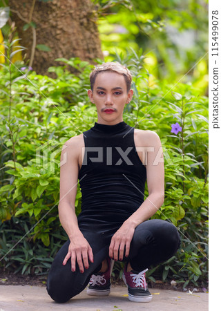 Beautiful Asian queer LGBT community supporter man with mustache wearing lipstick and jumpsuit Beautiful Asian queer LGBT community supporter man with mustache wearing lipstick and jumpsuit 115499078