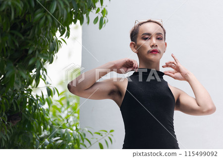 Beautiful Asian queer LGBT community supporter man with mustache wearing lipstick and jumpsuit Beautiful Asian queer LGBT community supporter man with mustache wearing lipstick and jumpsuit 115499092