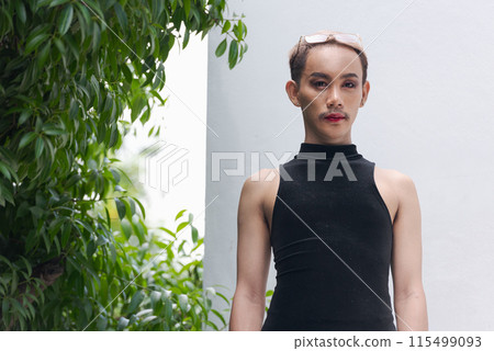 Beautiful Asian queer LGBT community supporter man with mustache wearing lipstick and jumpsuit Beautiful Asian queer LGBT community supporter man with mustache wearing lipstick and jumpsuit 115499093