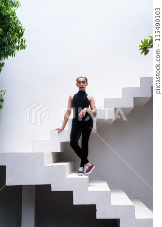 Full body shot of a queer LGBT community supporter man with mustache wearing lipstick and jumpsuit 115499103