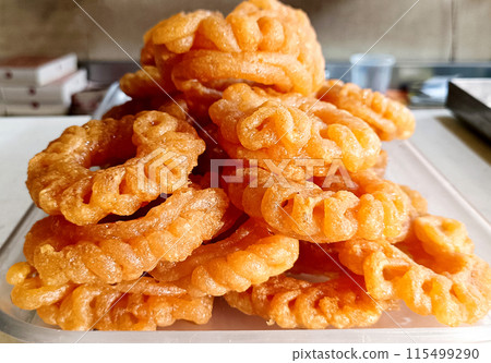 Indian Sweet Imarti at Shop, A circular shaped dessert 115499290