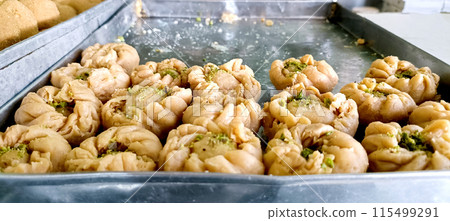 Traditional Indian sweet dish item Gujiya or Gujia for sale at the shop in vrindavan Traditional Indian sweet dish item Gujiya or Gujia for sale at the shop in vrindavan 115499291