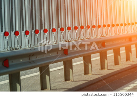 Safety barriers on highway. Anodized safety steel barrier. Enhancing highway safety. 115500344