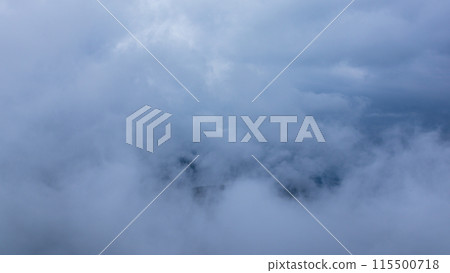 Clouds hanging over the mountain peak on a rainy day Clouds hanging over the mountain peak on a rainy day 115500718