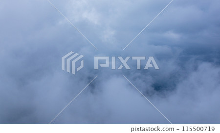Clouds hanging over the mountain peak on a rainy day Clouds hanging over the mountain peak on a rainy day 115500719