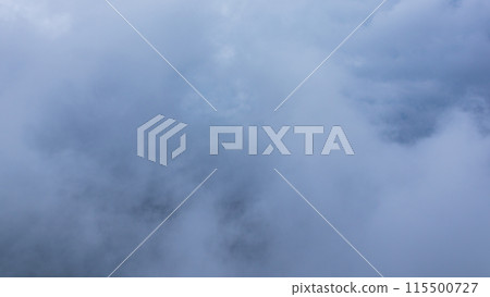Clouds hanging over the mountain peak on a rainy day Clouds hanging over the mountain peak on a rainy day 115500727