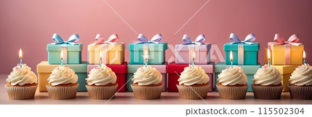 Colorful cupcakes with lit candles are displayed against a pink background, indicating an indoor celebration event marking of joy and celebrating. with free space 115502304