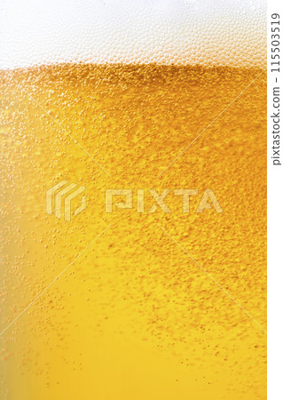 Draft beer poured into a glass, close-up 115503519
