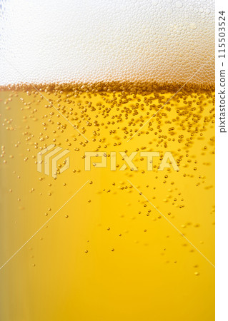 Draft beer poured into a glass, close-up 115503524