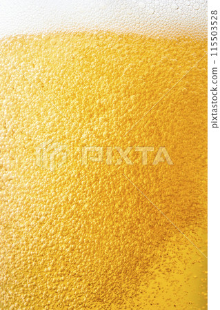 Draft beer poured into a glass, close-up 115503528