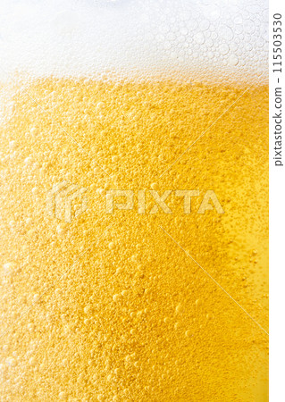 Draft beer poured into a glass, close-up 115503530