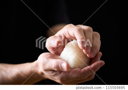 A man making rice balls A man making rice balls 115503695