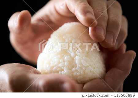 A man making rice balls A man making rice balls 115503699