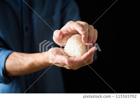 A man making rice balls A man making rice balls 115503702