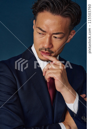 Thinking businessman 115503760