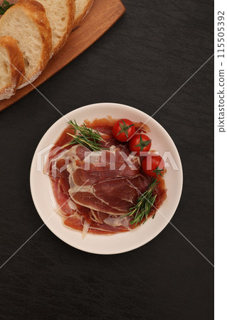 Prosciutto served on a plate 115505392