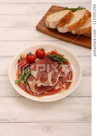Prosciutto served on a plate Prosciutto served on a plate 115505399