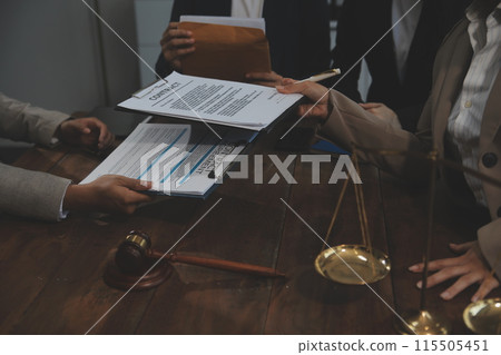 Judge gavel with Justice lawyers having team meeting at law firm background. Concepts of Law and Legal services. Judge gavel with Justice lawyers having team meeting at law firm background. Concepts of Law and Legal services. 115505451