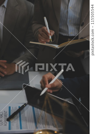 Judge gavel with Justice lawyers having team meeting at law firm background. Concepts of Law and Legal services. Judge gavel with Justice lawyers having team meeting at law firm background. Concepts of Law and Legal services. 115505544